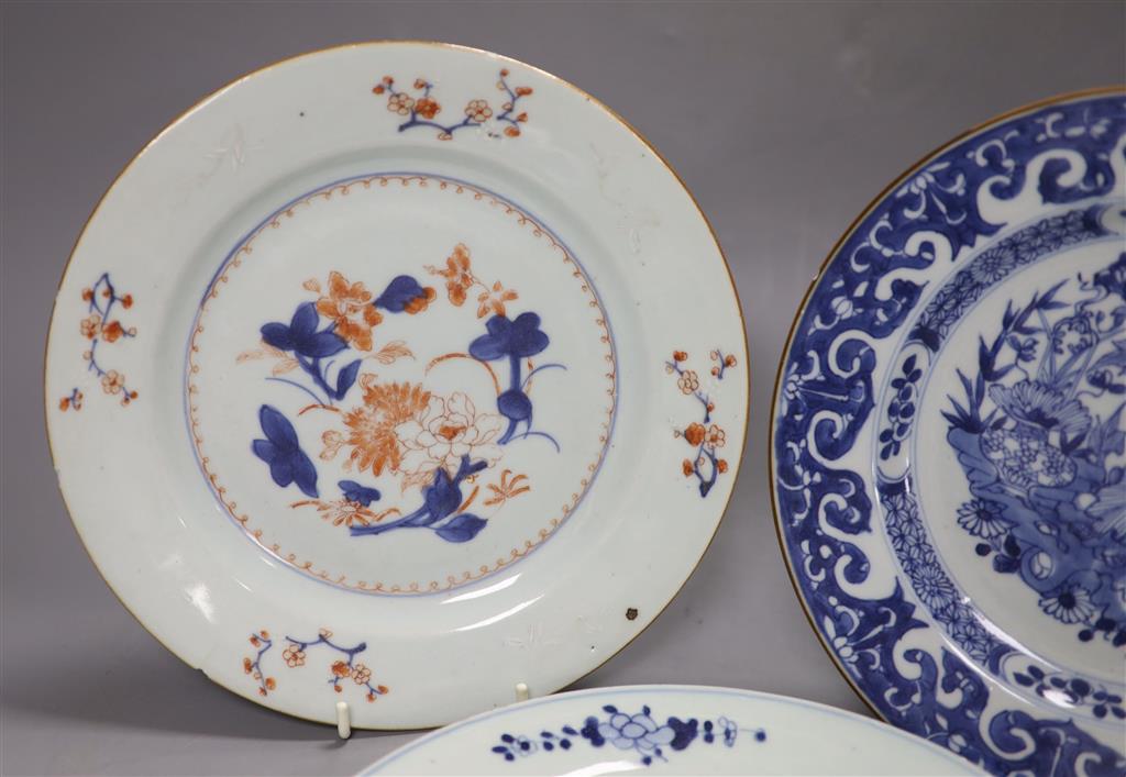 Three Chinese Qianlong plates, two blue and white, the third in Imari palette, diameter 23cm